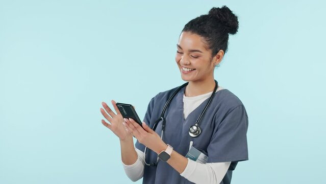 Doctor, woman laugh and phone for healthcare communication, social media meme or funny chat in studio. Student or young medical nurse on mobile for telehealth, typing and happy on a blue background