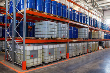 Petroleum products warehouse. Multi-tiered racks with barrels. Chemical company storage facility....