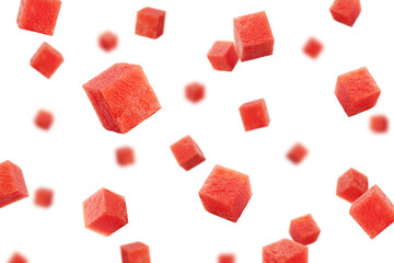 Falling Watermelon cubes isolated on white background, selective focus - obrazy, fototapety, plakaty