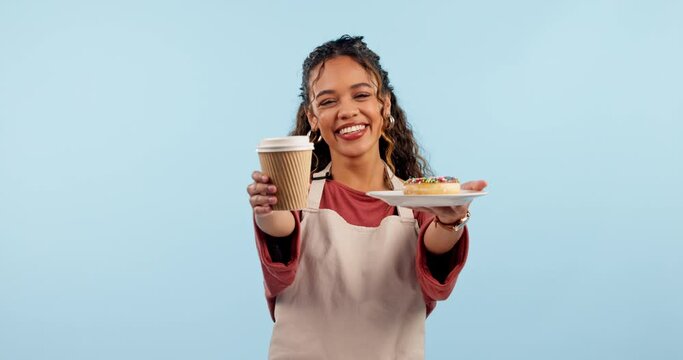 Coffee, donut and happy waitress, woman or cafeteria server giving restaurant food, morning drink or dessert. Studio portrait, cafe diner and barista with tea cup, sweets and smile on blue background