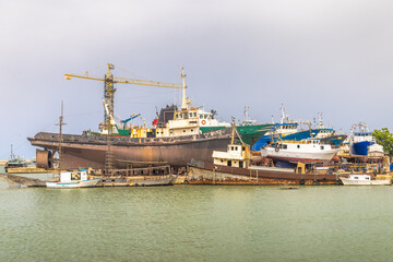 Shipwrecks in the harbor of Mazara del Vallo, town in southwestern of Sicily, Italy, Europe.