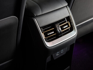Obraz premium Close up car ventilation system and air conditioning for rears seats details and controls of modern car
