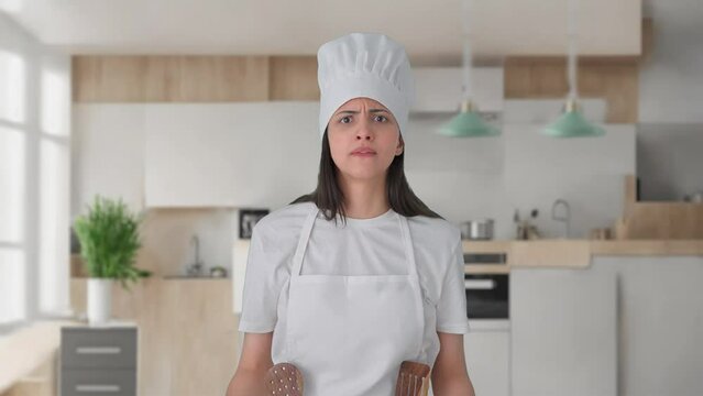 Angry Indian female professional chef shouting on someone