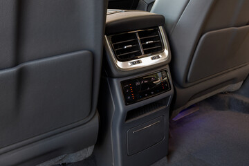 Close-up. Climate control system control panel for rear passengers