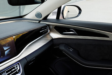 view of the passenger seat and the right side of an expensive new car