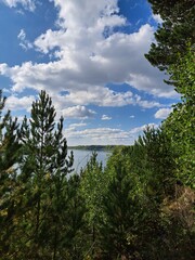 Obraz premium lake and mountains trees in the forest coast of siberian river autumn sunny day landscape photo image