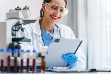 Young scientists pioneering medical discoveries in lab, with one scientist employing microscope for invaluable insights, blood lab test, virus vaccine invent, asian indian people