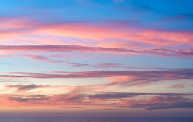 Fototapeta premium Red clouds at sunset over the sea