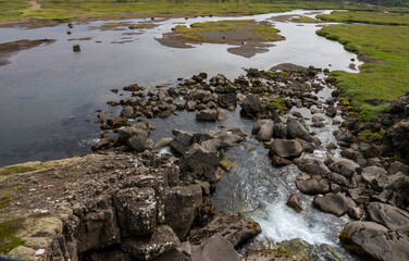 Thingvellir National Park, Rocks in the river Oxara over the Almannagjá. The base of the waterfall Öxarárfoss Waterfall fall is filled with rocks as seen here. 