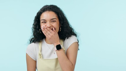 Laughing, funny and a young woman in studio with a joke, carefree humor and good mood. Face of a gen z girl with hand, giggle and portrait on a blue background for fun energy, fashion and reaction