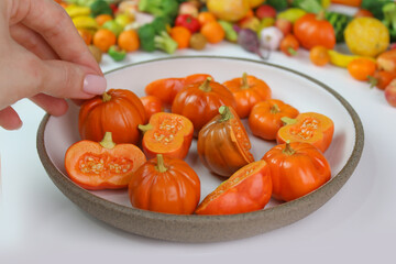 Orange pumpkins in a round plate