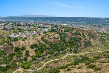Fototapeta na wymiar Aerial view of house in Serra Mesa City in San Diego, California, USA. Green Dry Valley and Villas