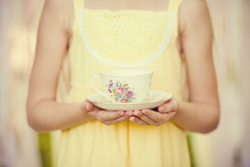 Girl Holding Teacup