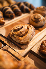 Shot of a group of cinnamon rolls in a cafe showcase. Brunch concept.