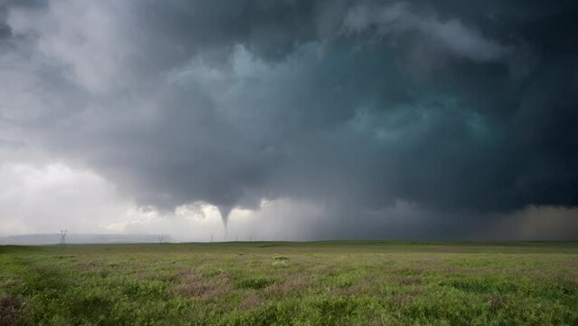 Mesmerizing Tornado Touches Down Near Power Lines On The Open Plains