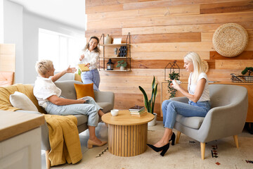Mature women taking part in book club at home