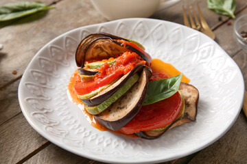Plate of tasty Ratatouille on wooden background