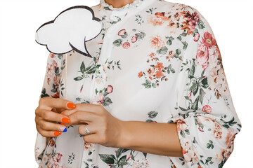 A woman in a white dress with a pattern of flowers holds in her hands with a manicure, an empty space for thoughts and design blank