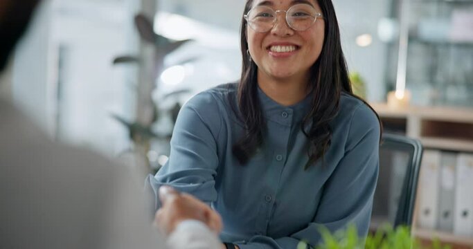 Happy asian woman, handshake and interview in meeting, partnership or teamwork for hiring at office. Business people shaking hands in recruiting, b2b or thank you for agreement or deal at workplace