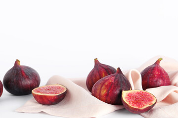 Fresh juicy cut figs isolated on white background