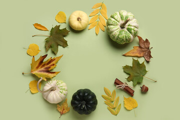 Frame made of ripe pumpkins and autumn leaves on color background © Pixel-Shot