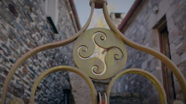 four legged triskel decoration in a well in o cebreiro galicia slow motion