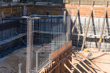 Naklejka premium Reinforcement metal framework REBAR at a construction site