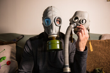 Civilian wearing nuclear gas mask during nuclear fallout and a time of war