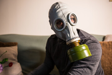 Civilian wearing nuclear gas mask during nuclear fallout and a time of war - obrazy, fototapety, plakaty