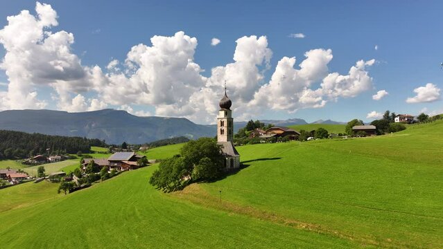 Amazing nature landscape in the Italian Alps. Wonderful summer view of St. Valentin Church on alpine meadow in Kastelruth. Location Dolomites, Alps, Bolzano, South Tyrol, Italy, Europe
