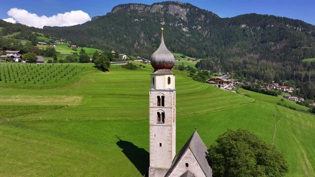 Amazing nature landscape in the Italian Alps. Wonderful summer view of St. Valentin Church on alpine meadow in Kastelruth. Location Dolomites, Alps, Bolzano, South Tyrol, Italy, Europe