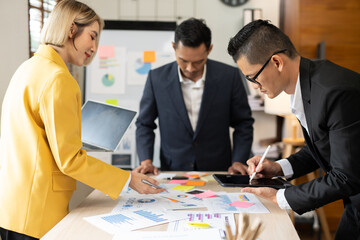 Asian businessmen, women and men Talk about new projects, presents at home office.