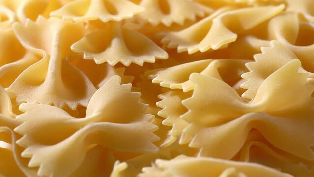 Close-up video of dried pasta. Farfalle. sideways movement.