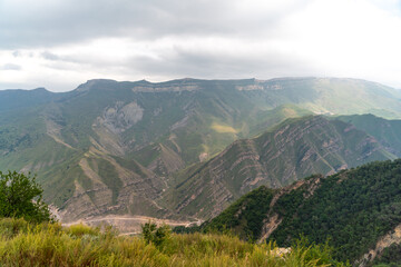 Caucasian mountain. Dagestan. Trees, rocks, mountains, view of the green mountains. Beautiful summer landscape.