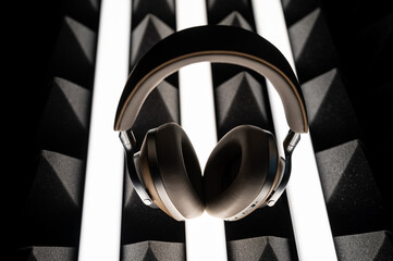 headphones on a dark foam background with lights