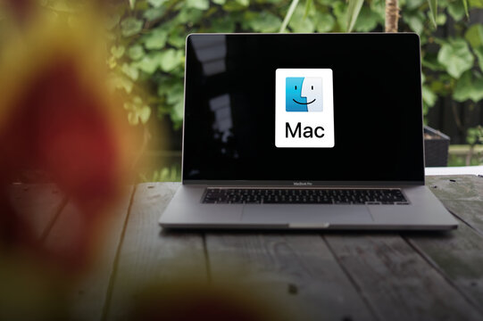 MacOS logo (Mac OS X), an operating system developed by Apple Inc., displayed on a MacBook Pro screen
