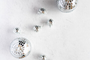 A new year's eve flatlay of disco ball christmas tree ornaments