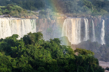 Beautiful view to Iguassu Falls waterfalls with rainbow and green