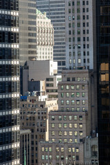 Collage of city buildings clustered together vertical