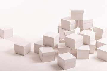 Stack of white gift boxes and copy space over white background