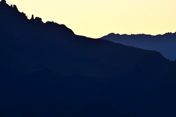 Dolomites Mountain Silhouett at sunset trees colorfull high contrast