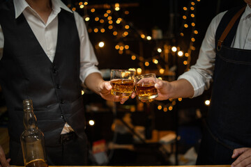 Barman pouring whiskey whiskey glass beautiful night