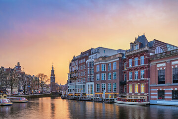 Amsterdam Netherlands, sunset city skyline of Dutch house at canal waterfront - 647977807