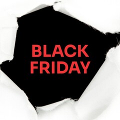 Ripped white paper revealing black friday text in red on black background