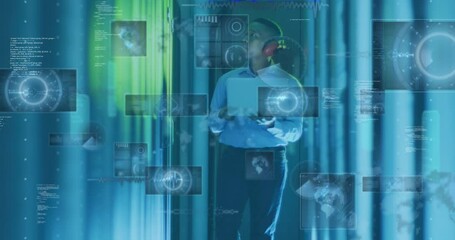 Animation of globes, computer language, african american engineer examining data server using laptop - Powered by Adobe
