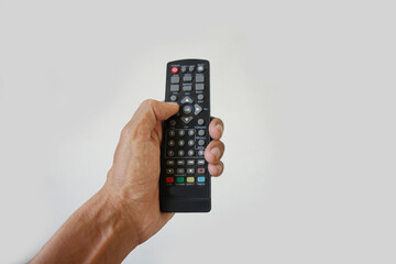 picture of Asian man's hand holding television remote isolated on white background