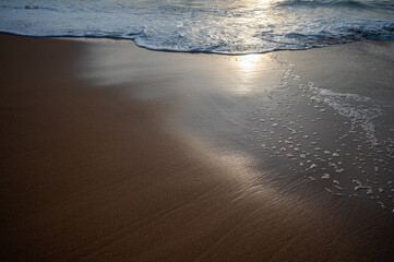 Soft wave of the sea on the sandy beach