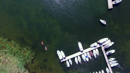 Aerial of Yachts and Piers in Harbor on Lake Top Down
