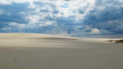 Fototapeta na wymiar Timelapse of Sandy Desert and Dark Storm Clouds