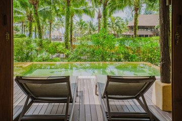 living room Interior of a modern house with a swimming pool, modern pool villa at the beach, indoor view of a luxury villa in Thailand